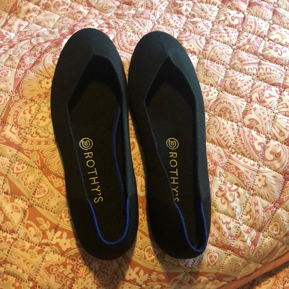 Rothy’s black flat shoes. The size is10W